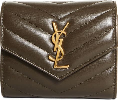 monogram matelassé leather trifold wallet.